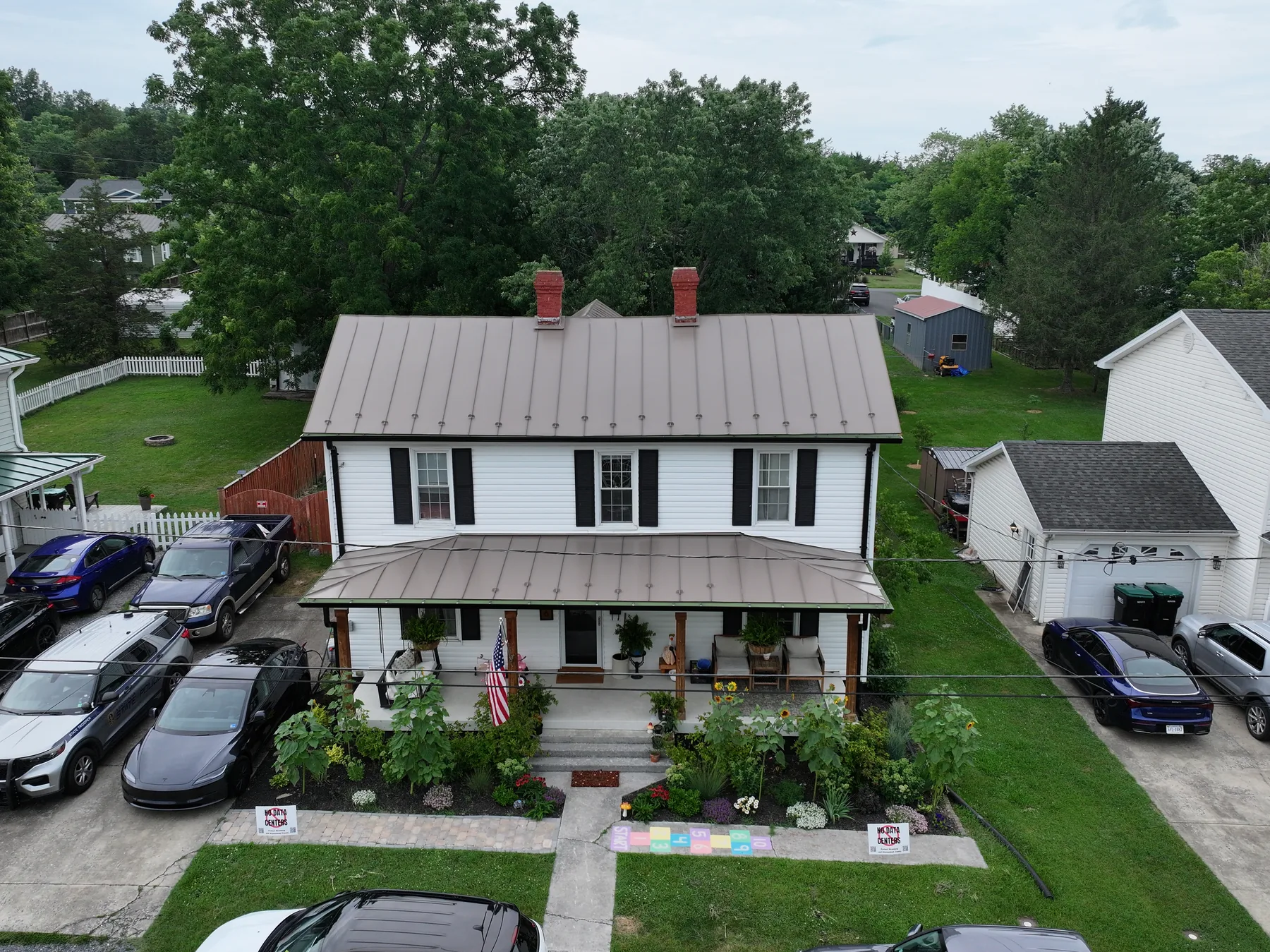 Front aerial view of the standing seam roof, siding, and wrapped window trim in Woodstock