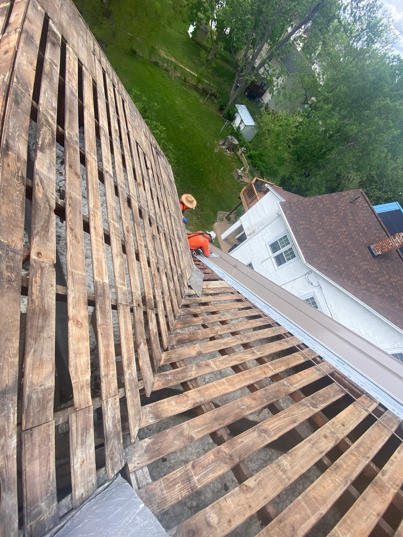 Exposed wood roof deck during a metal roof replacement in Harrisonburg, Virginia